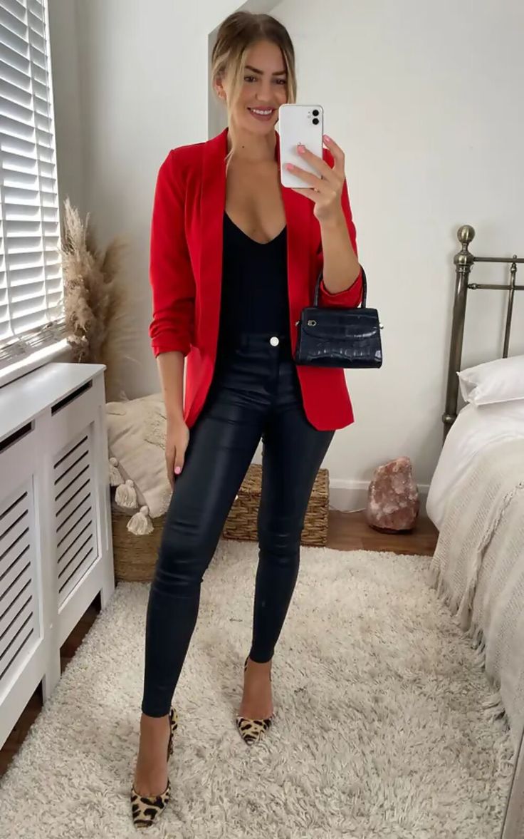 black top under a red leather blazer